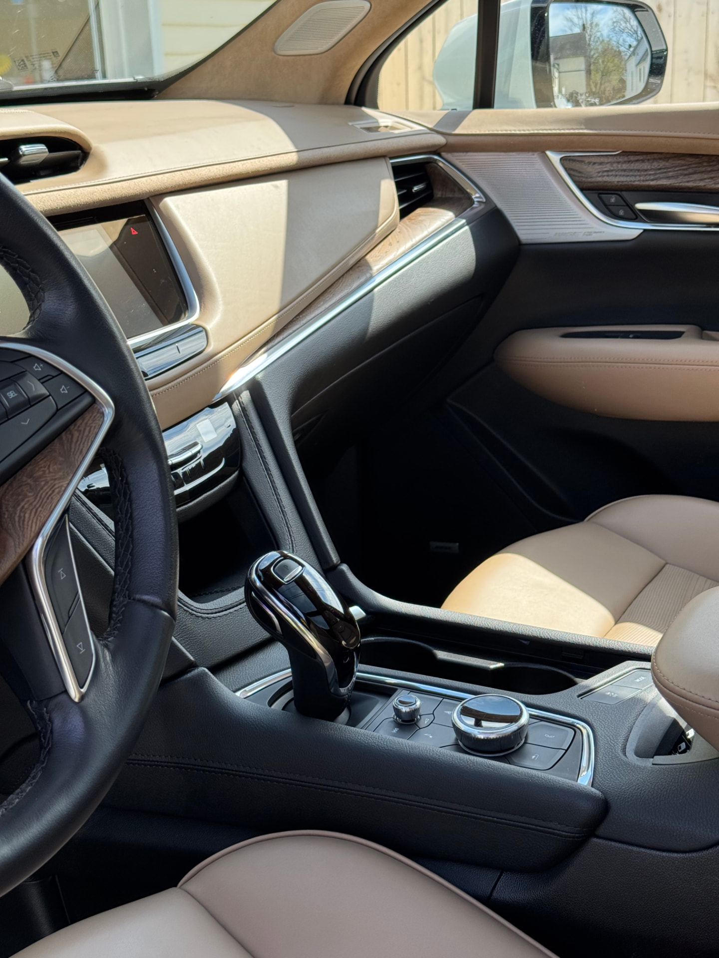 Freshly detailed SUV interior with clean leather seats, dashboard and center console